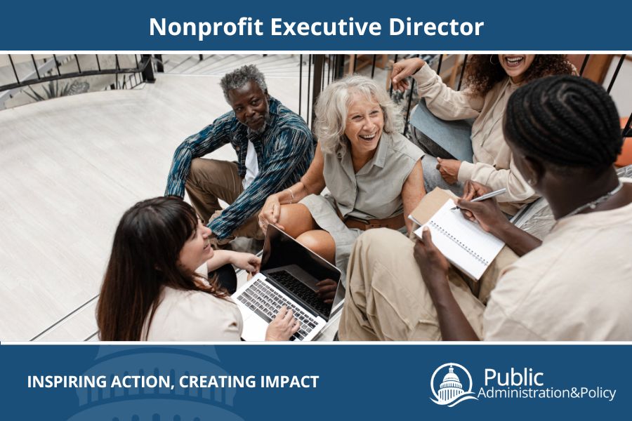 Nonprofit executive director sitting on steps with other professionals