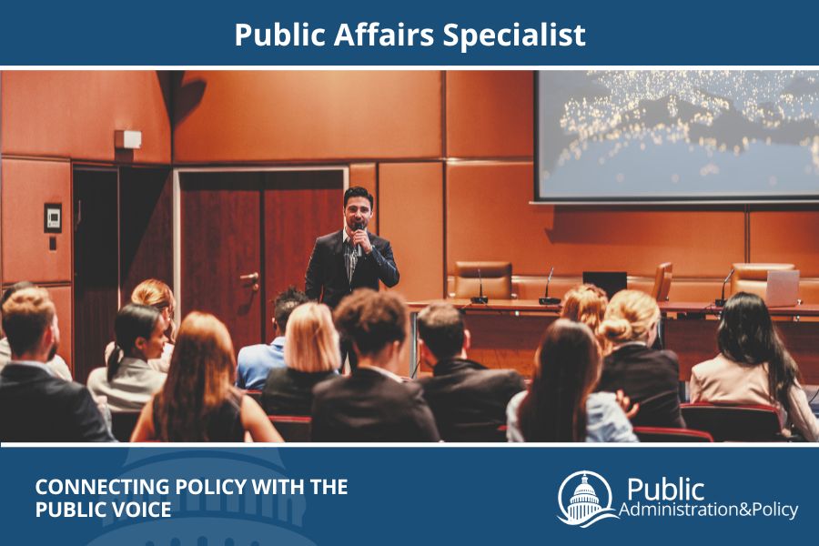 Public affairs specialist speaking into a microphone at a public session