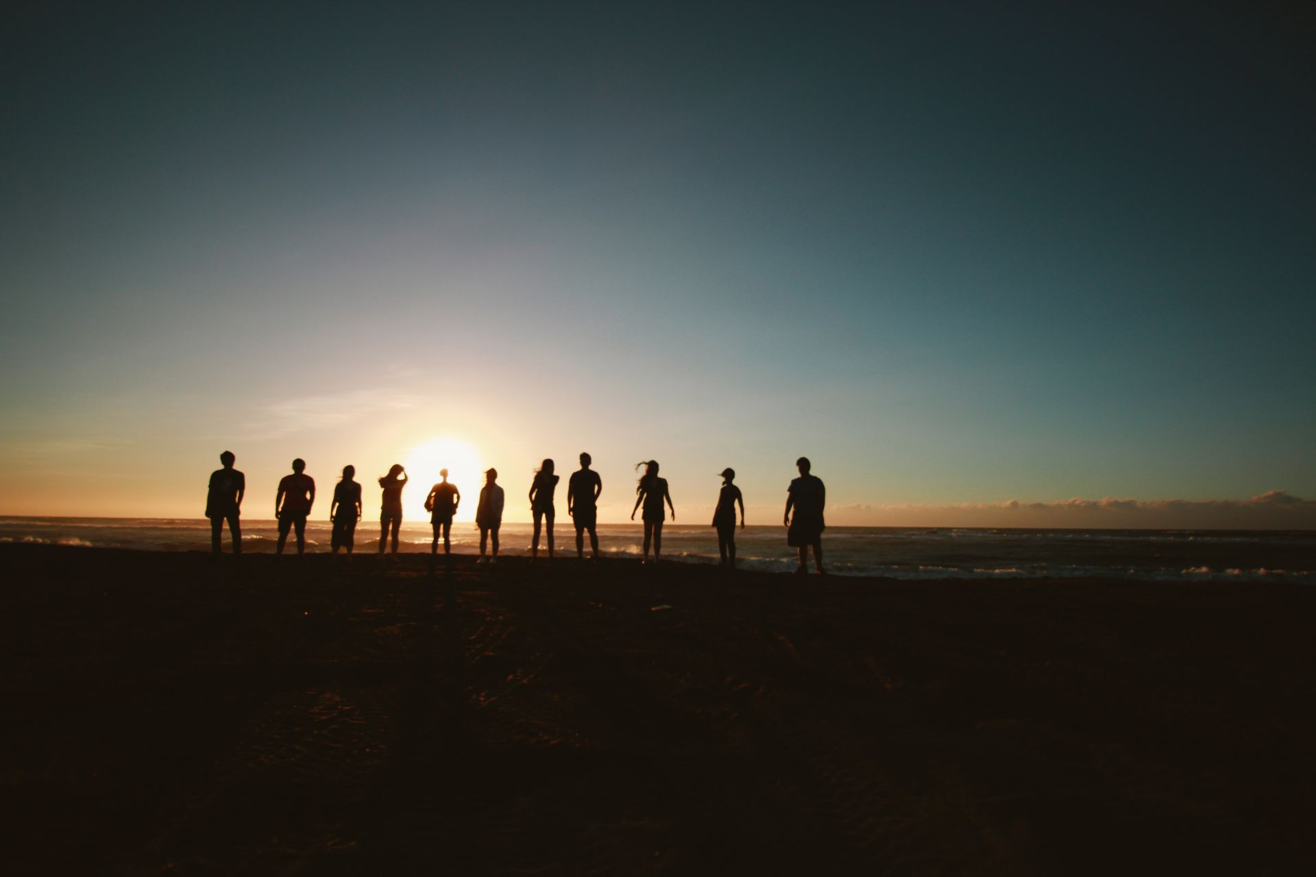 Silhouette of a group of people contemplating How Does Urban Planning Improve Quality of Life?